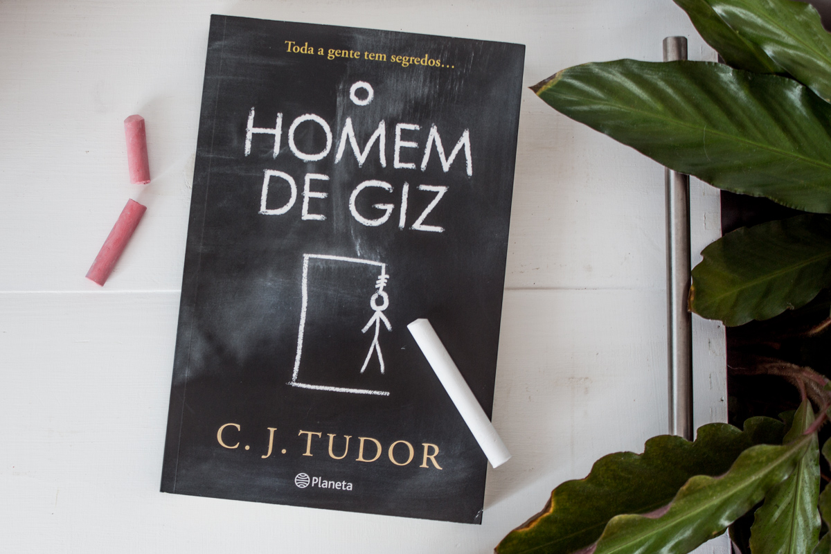 Book next to a piece of chalk as if the cover was drawn with it.