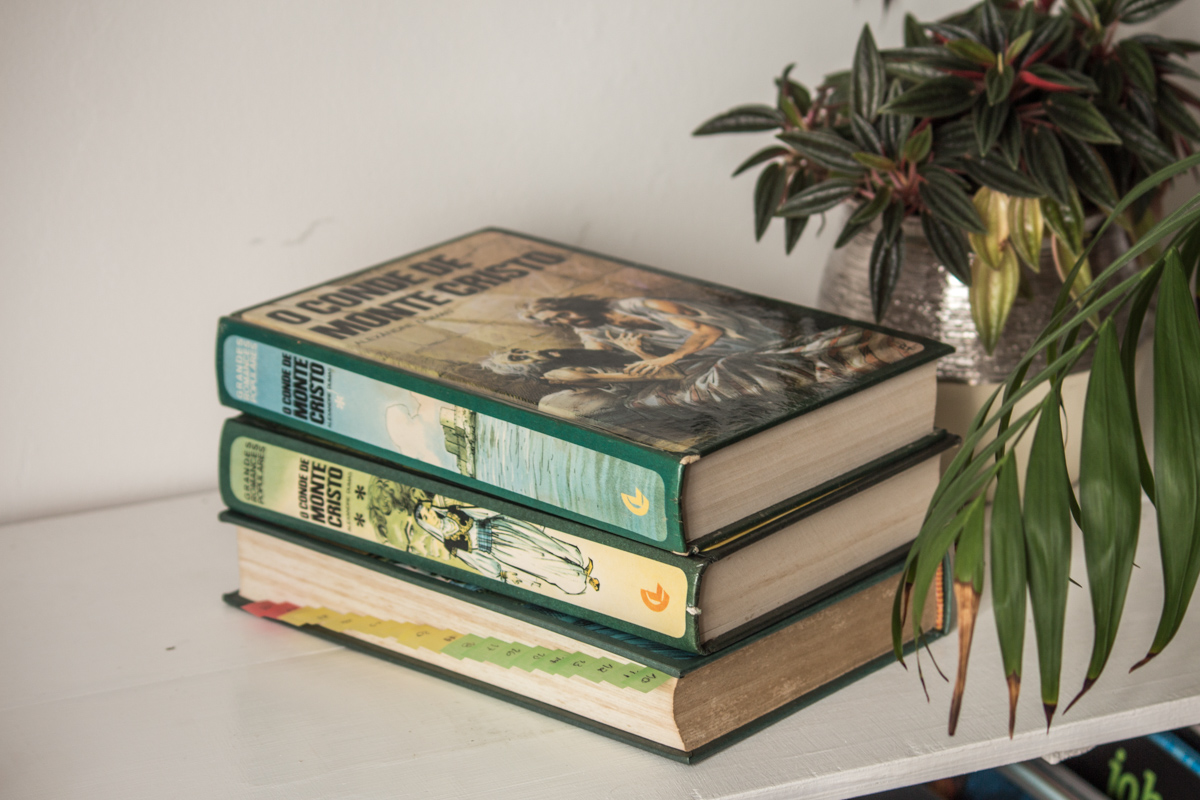 Stack of books of the three volumes of The Count of Monte Cristo by Alexandre Dumas.