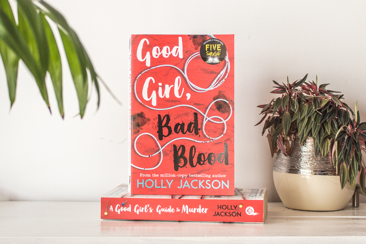Book Good Girl Bad Blood by Holly Jackson propped up.