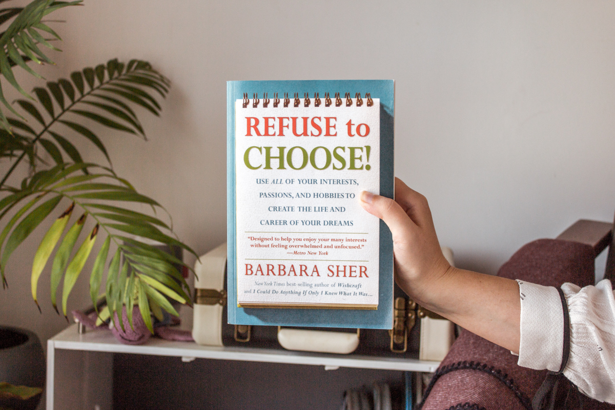 Hold the book up with one hand.