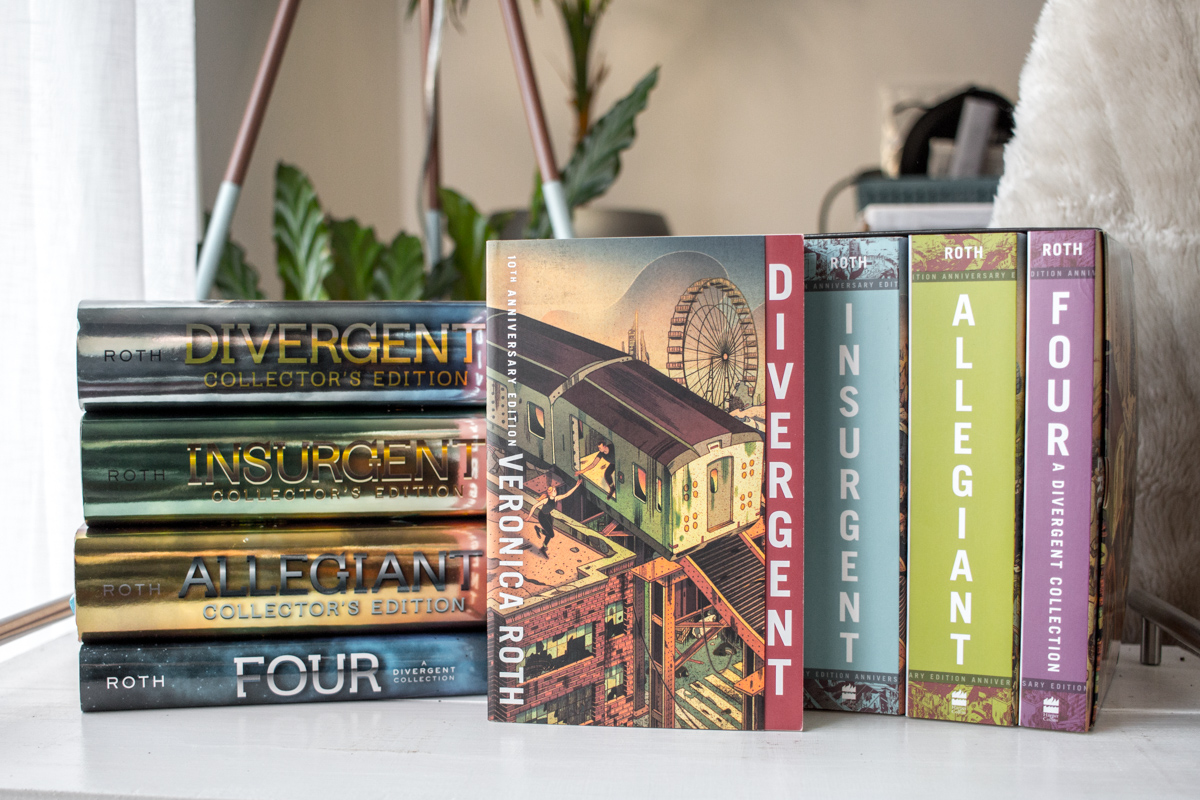 A stack of the Divergent Collector's Edition to the left and the box set of the anniversary editions to the right with the Divergent cover in the middle.